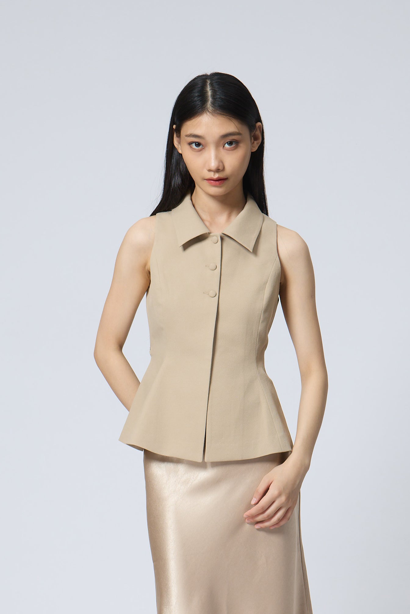 The Peplum Tailored Vest Blouse