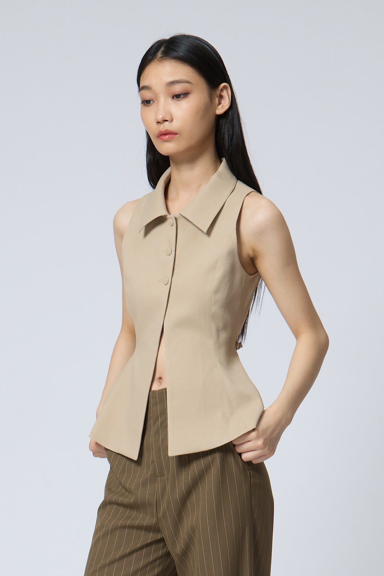 The Peplum Tailored Vest Blouse