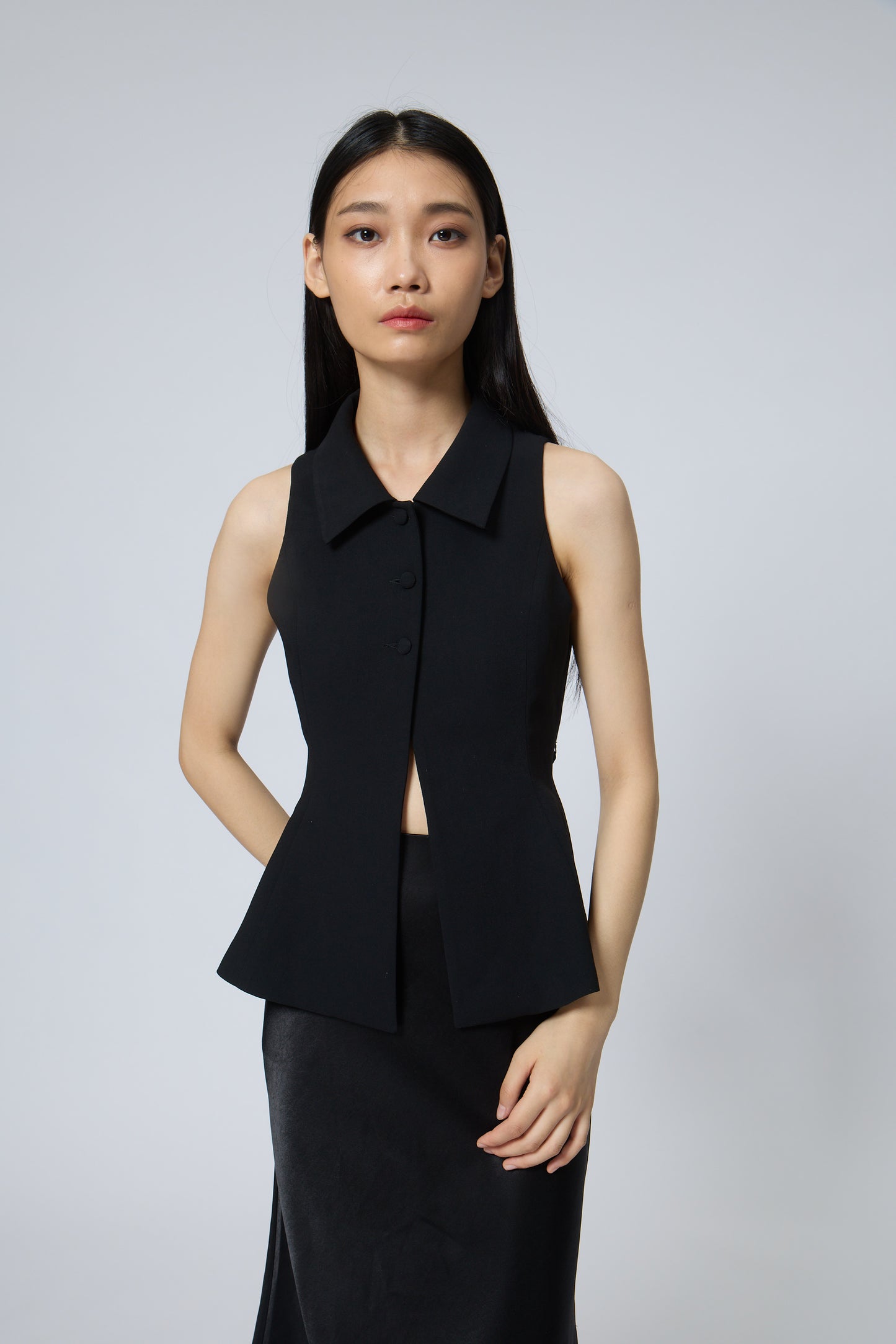The Peplum Tailored Vest Blouse