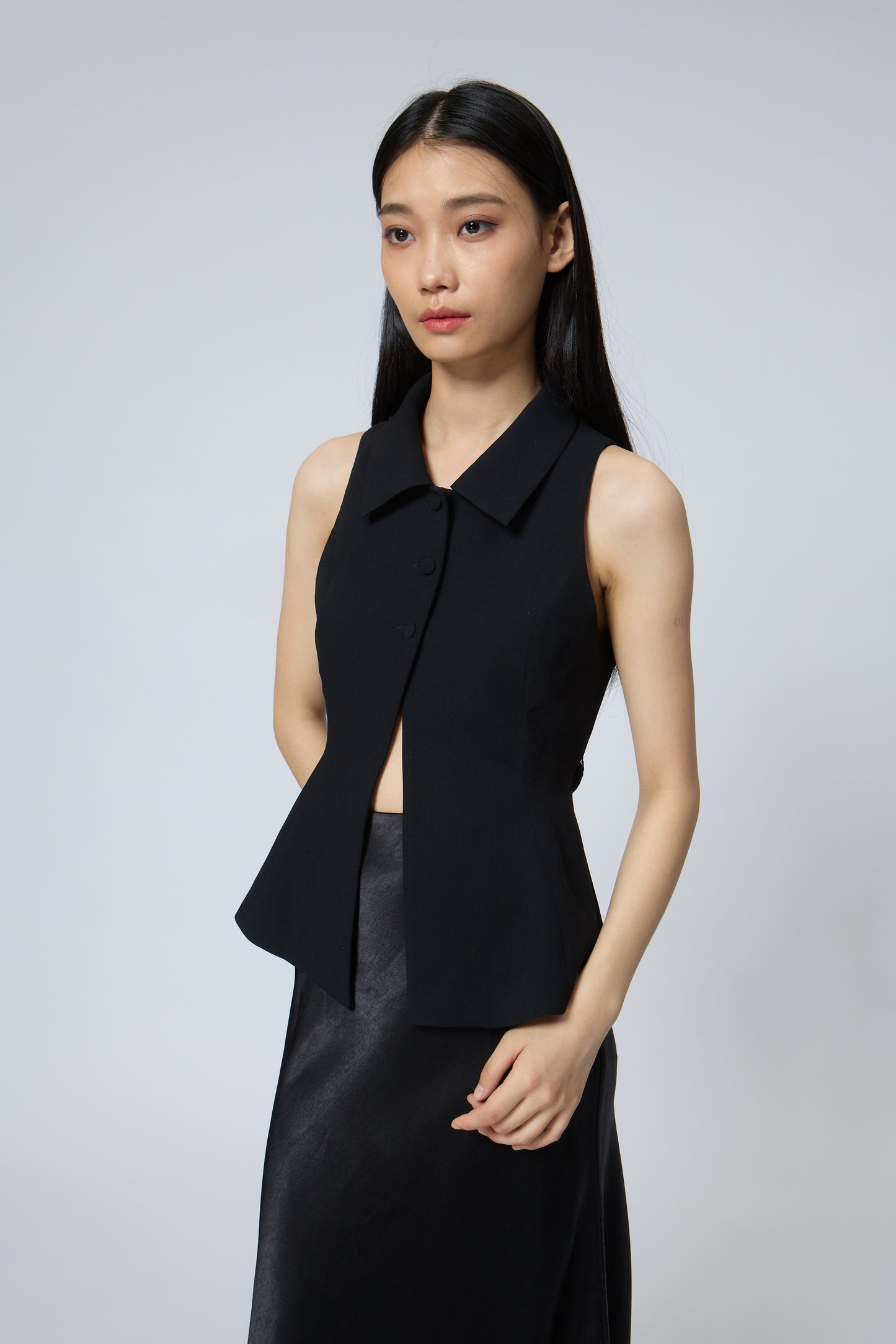The Peplum Tailored Vest Blouse